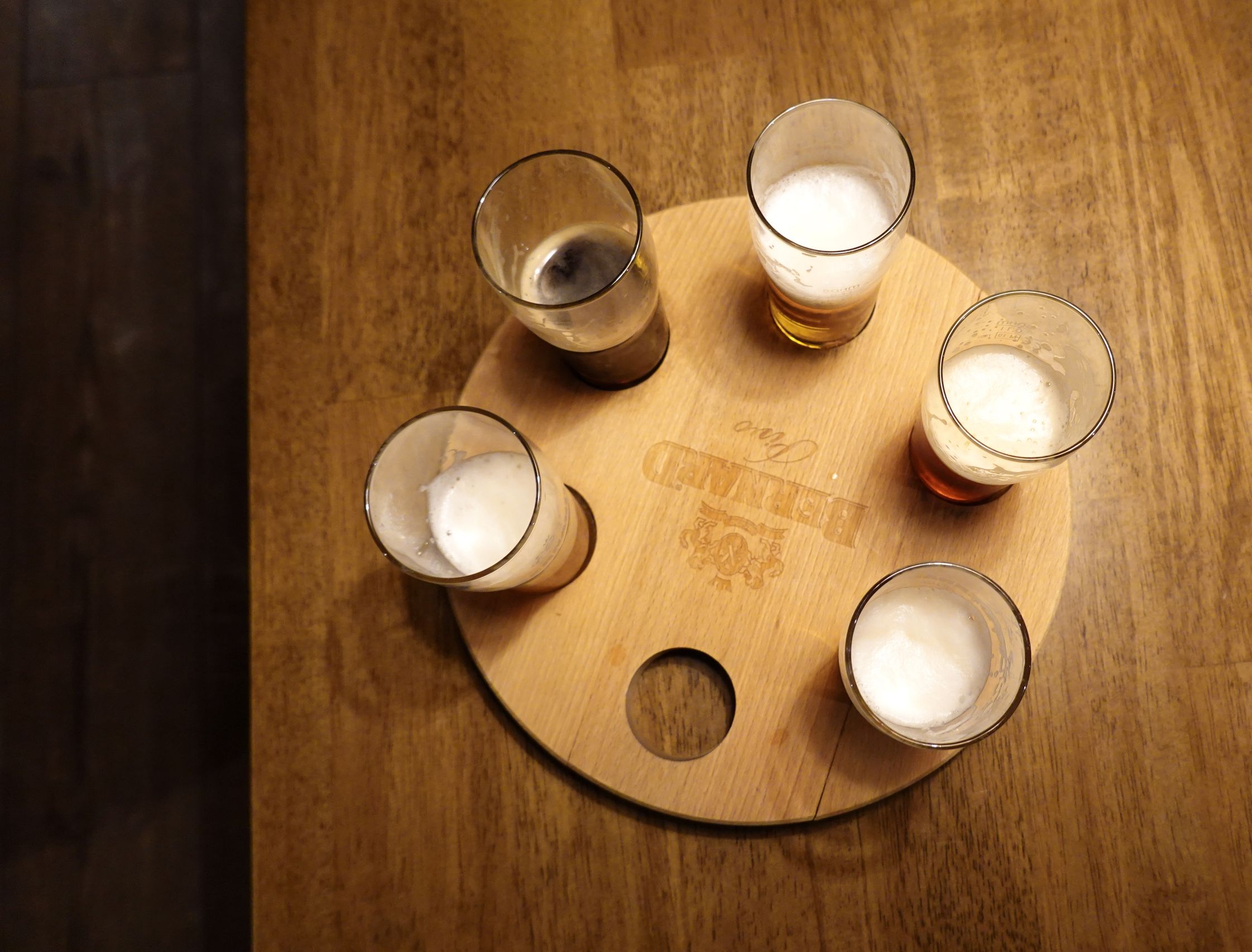 five-beer-glasses-on-bar