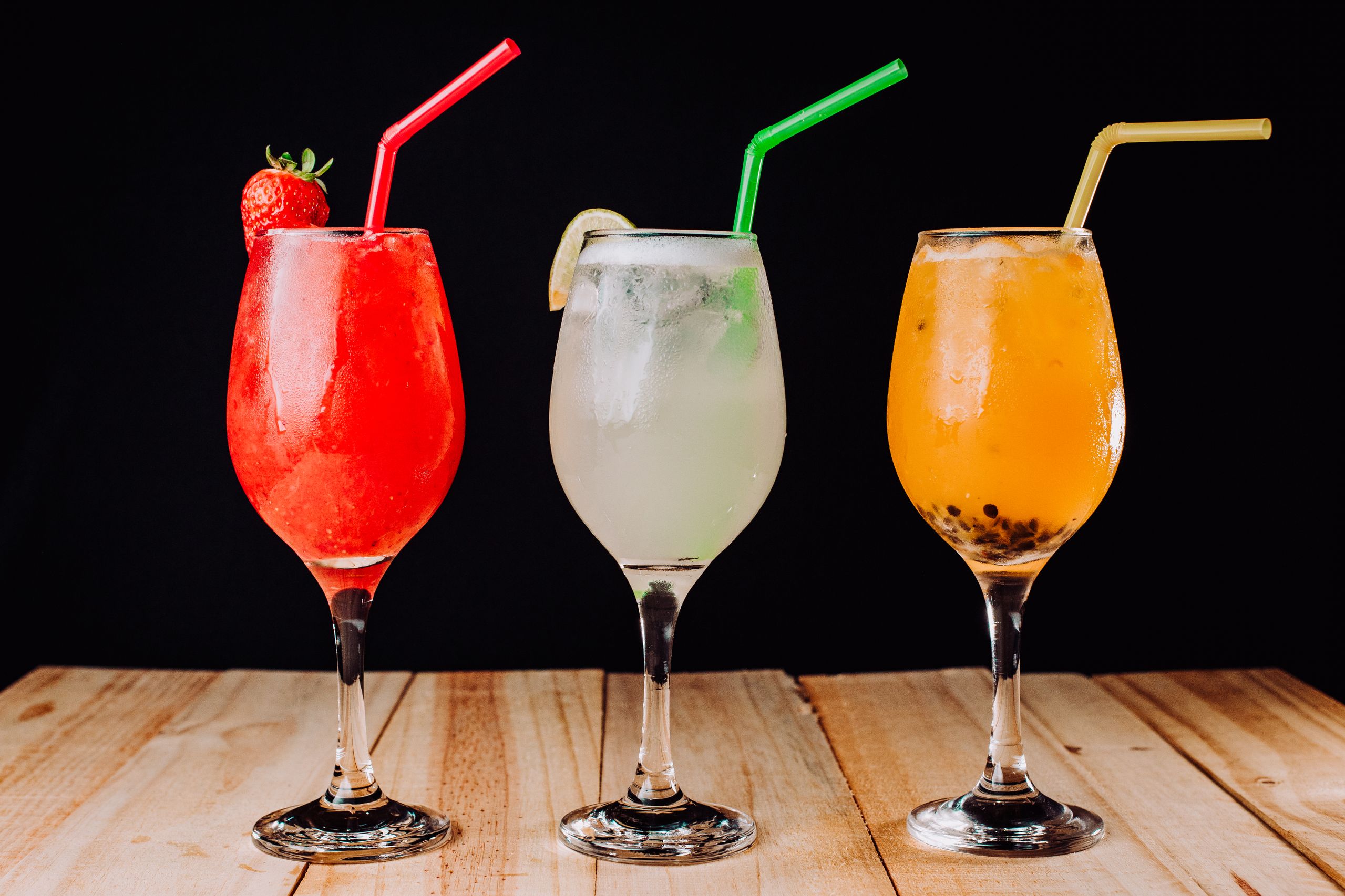 three-cocktails-on-dark-table
